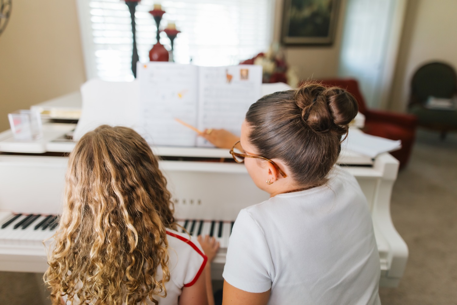 Lena teaching piano
