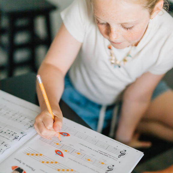 Student working in music workbook